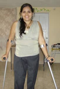 Anita walks with 2 crutches