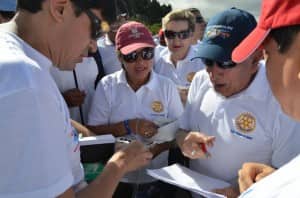 Rotary members sign in participants